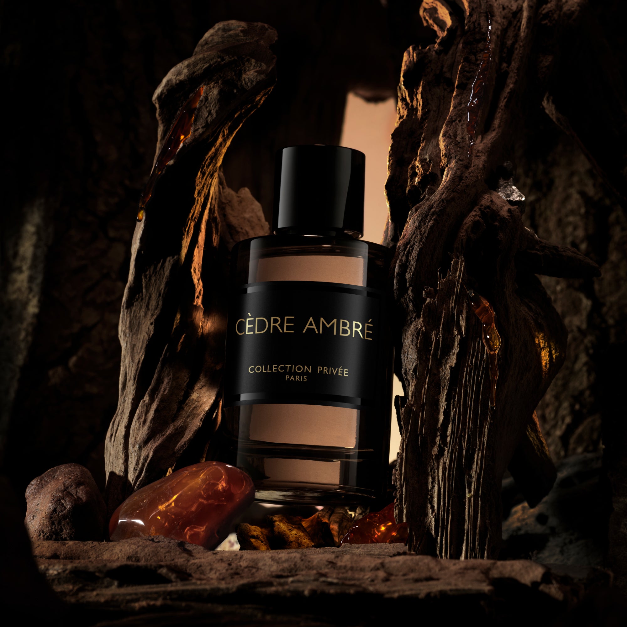A perfume for men in a dark environment, surrounded by wood, honey and amber stones glowing.